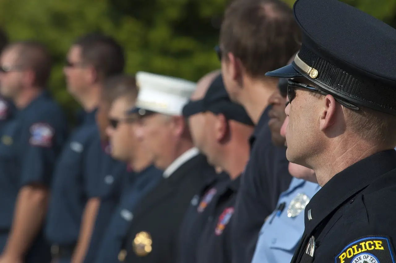 Line of police officers in uniform, representing pre-employment screening